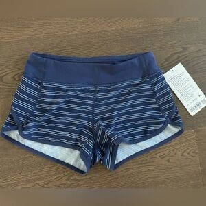 Lululemon Ivivva speedy shorts in navy and white striped pattern, size 12